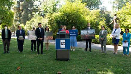 Assemblymember speaking at podium