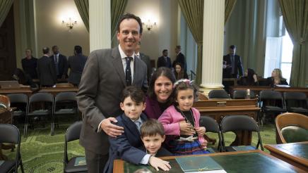 Assemblymember Bauer-Kahan being sworn in at the State Capitol