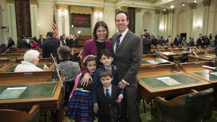 Assemblymember Bauer-Kahan being sworn in at the State Capitol